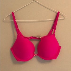 A pink 34C Victoria Secret push-up bra